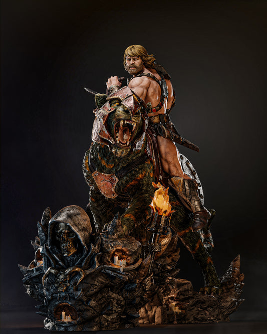 A dynamic sculpture of He-Man riding Battle Cat, featuring He-Man poised heroically with a sword and Battle Cat roaring fiercely, set against a dark background.