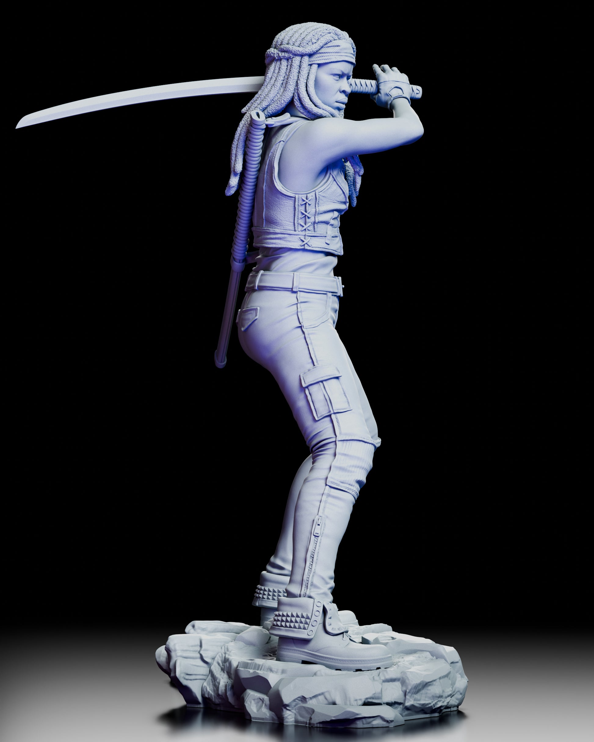 Right-angled view of the Michonne figure kit showing the katana’s curve, her focused expression, and the fine sculpting of her boots and base.